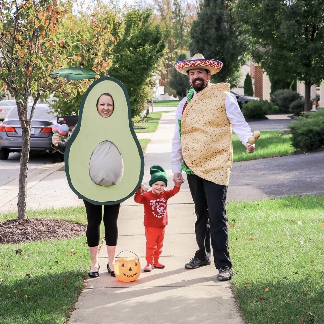 Family dressed up as taco, avocado and hot sauce for Halloween.