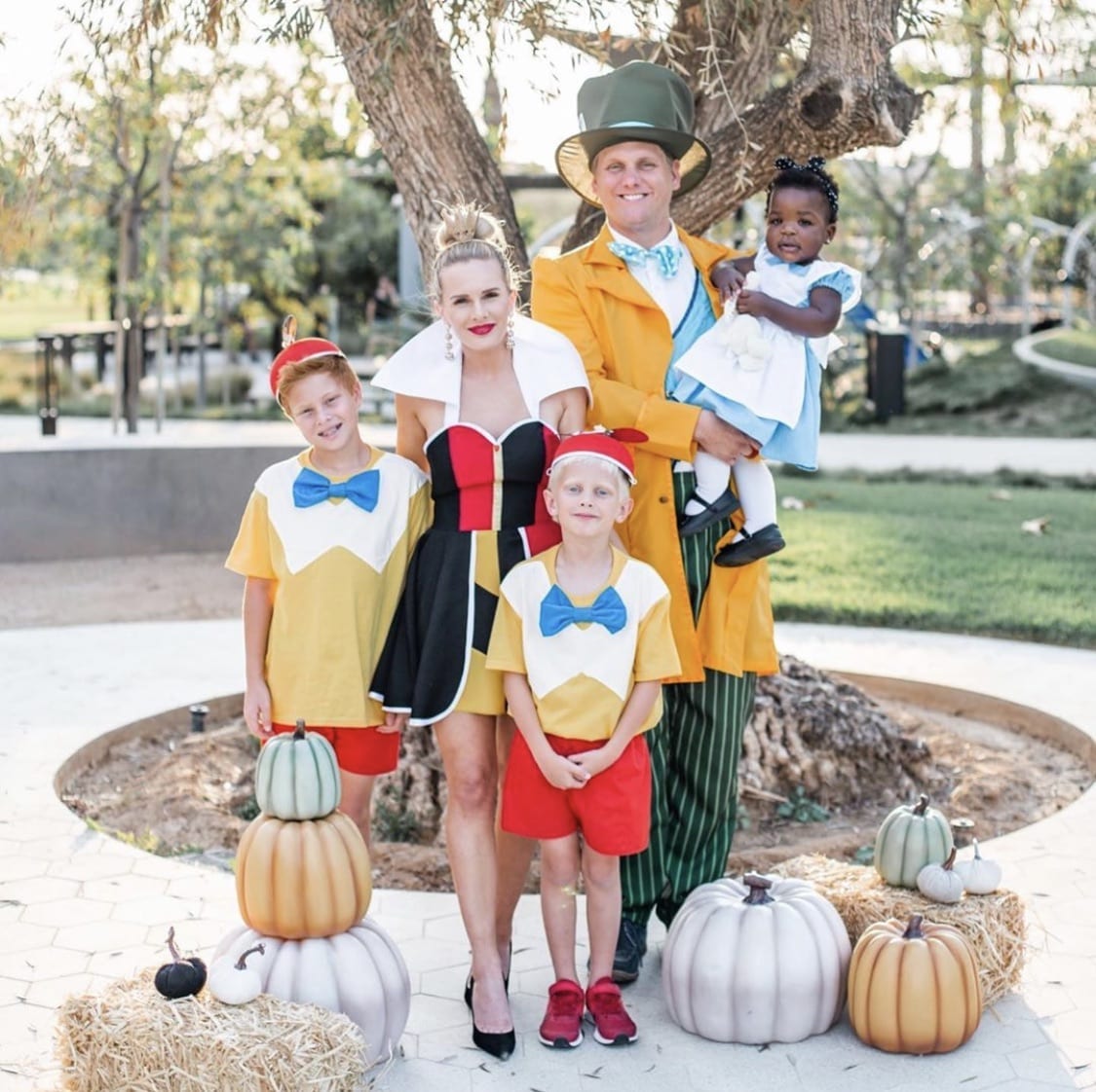 Family dressed up as the characters from Alice in Wonderland for Halloween.