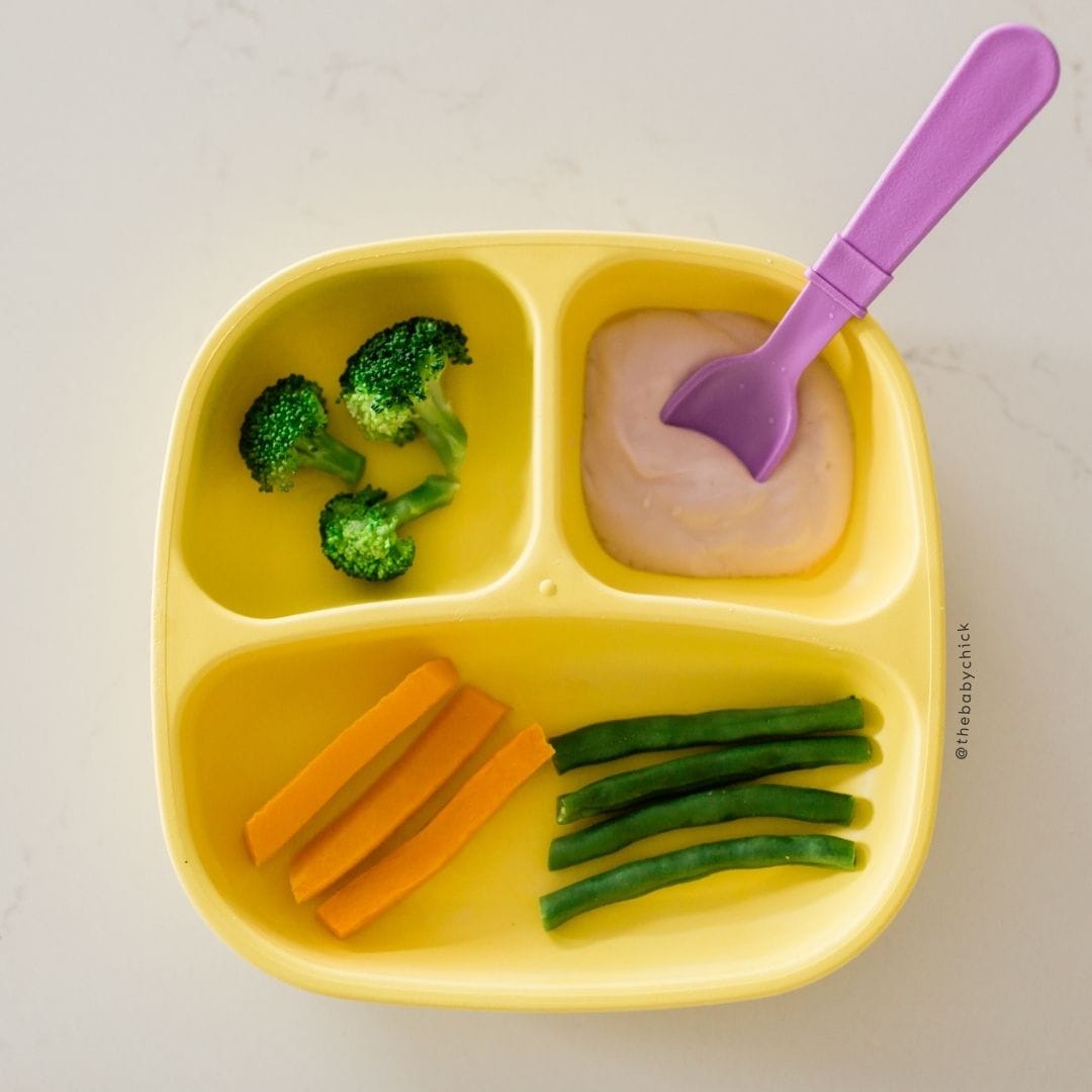 Toddler plate with vegetables and yogurt.