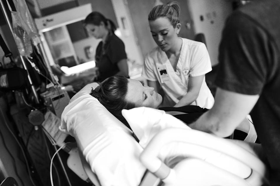 A doula helping a woman in labor
