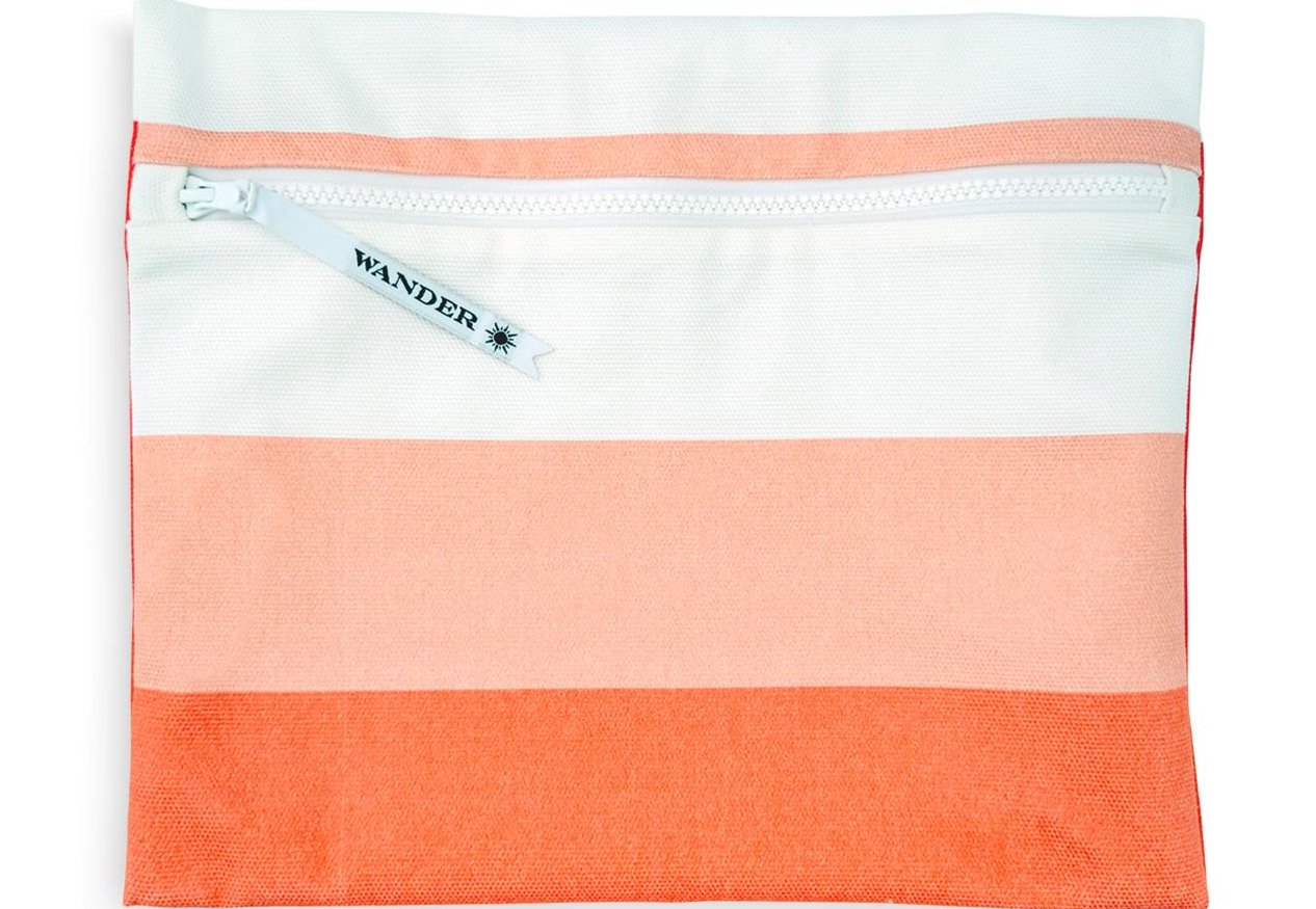Wet bag in orange, peach, and white stripes