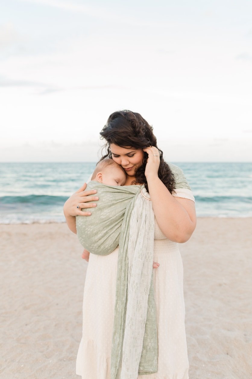 30-Year-Old Cuban Mother With Her 5-Month-Old Cuban-American Son in a Sage-Green Ring Sling Baby Carrier While at the Beach in Palm Beach, Florida in the Spring of 2022