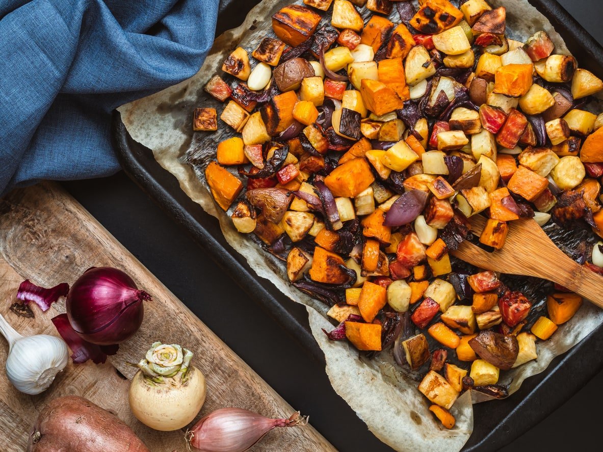Roasted root vegetables on a baking sheet.
