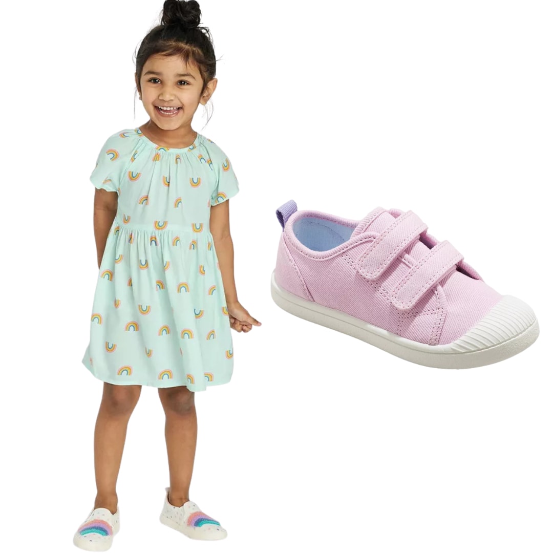 Girl in rainbow dress with pink sneakers 