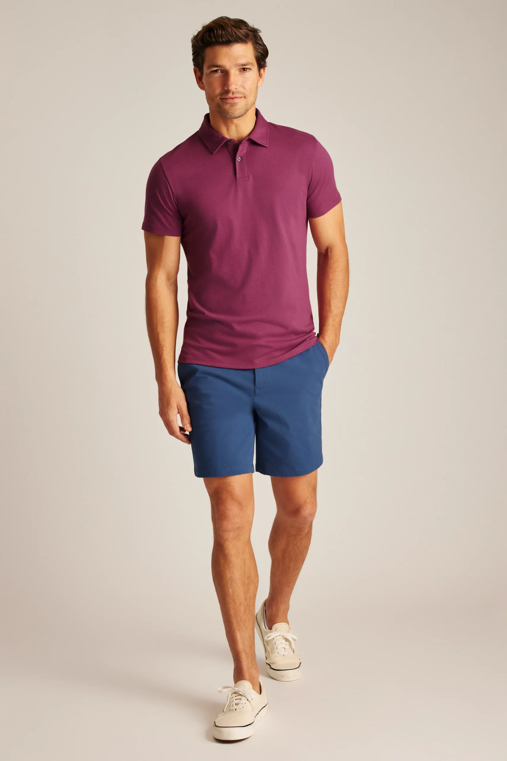 Man in Jetsetter Performance Polo from Bonobos in maroon and blue shorts 