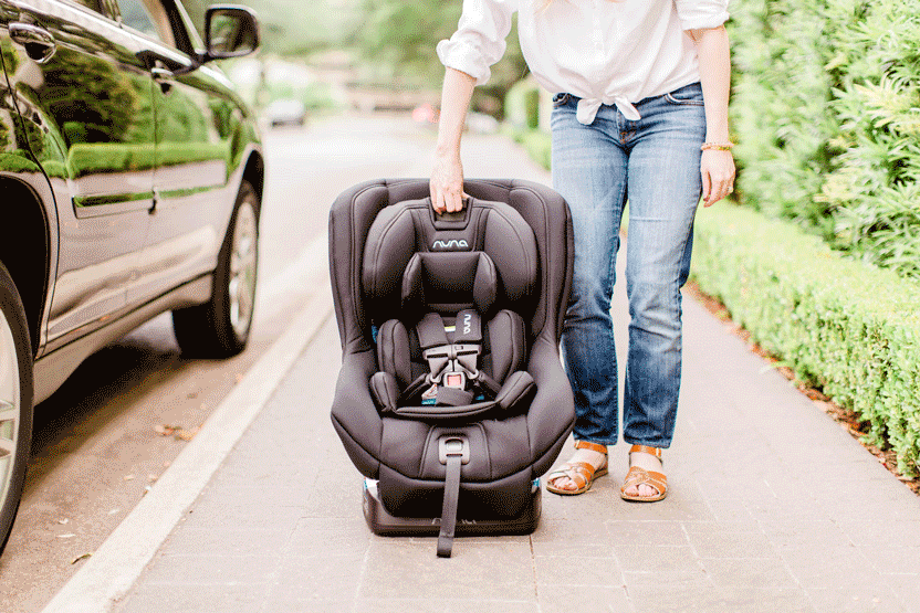 Using the one handed harness adjuster on the Nuna Rava convertible car seat.