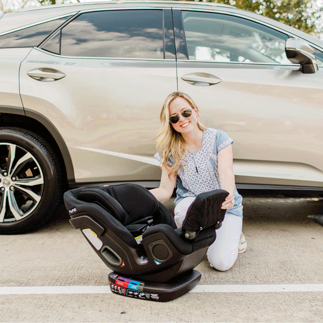 Nina Spears showing how the NUNA EXEC all-in-one car seat can recline and the head rest can raise.