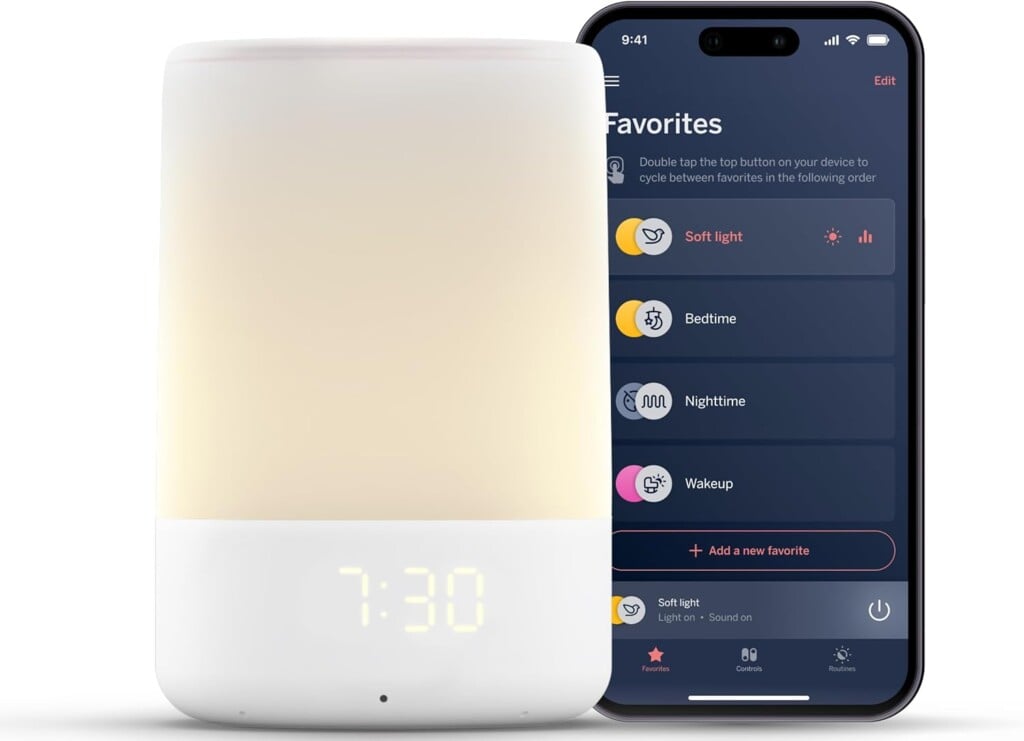 A cylindrical smart alarm clock with a soft light and digital display reads 7:30. It is next to a smartphone showing a favorites screen with options for soft light, bedtime, nighttime, and wakeup settings—ideal postpartum essentials for new moms. The phone's time displays as 9:41.