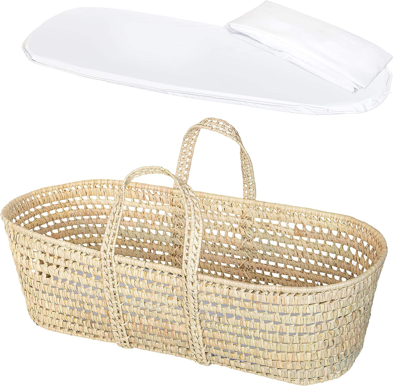 A woven wicker baby Moses basket is shown with two handles. Above the basket, a white fitted mattress pad and pillow are displayed. The basket's natural material and open weave design are visible, making it an ideal addition to your postpartum essentials for a comfortable recovery.