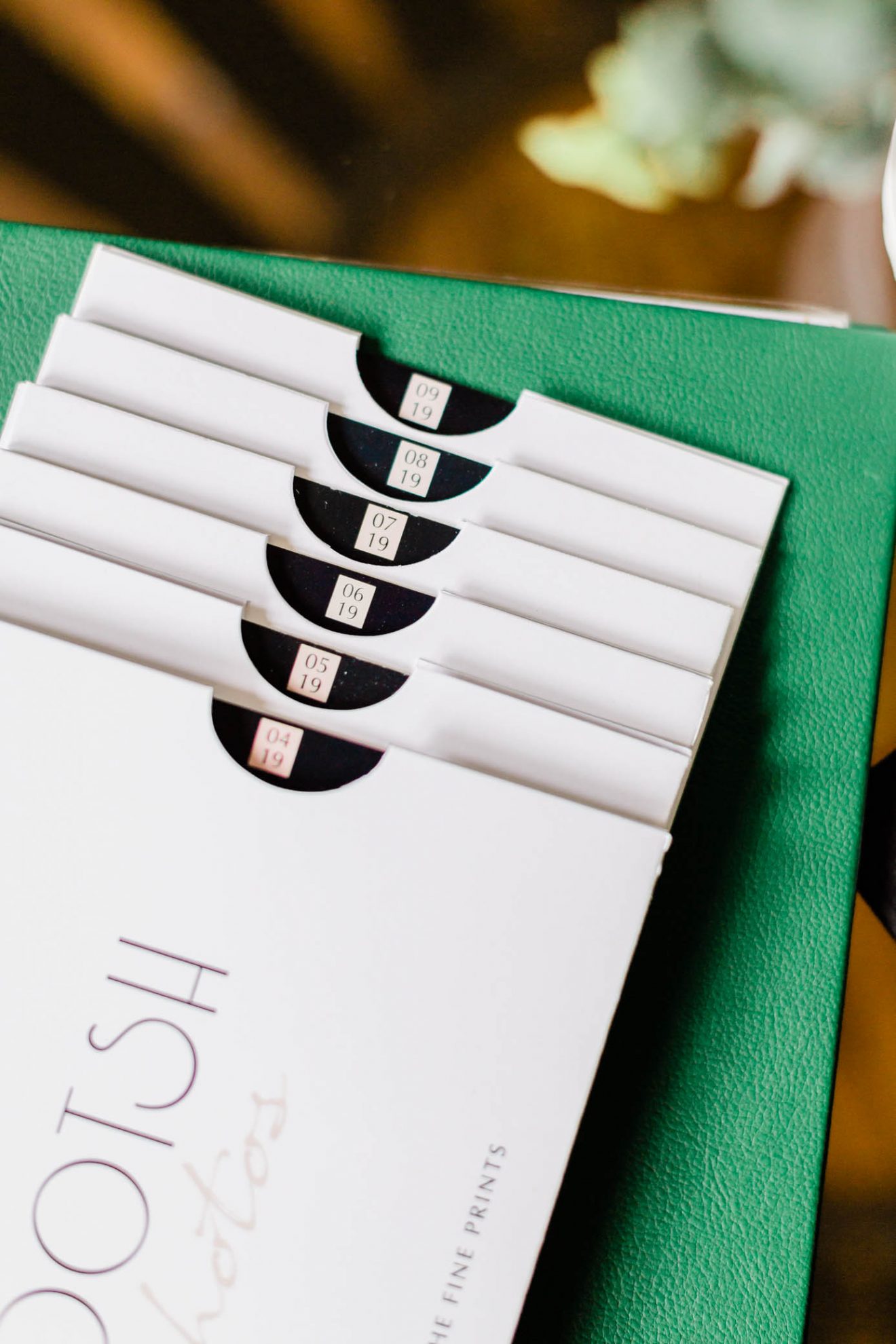 A stack of Mootsh envelopes laying on a table.