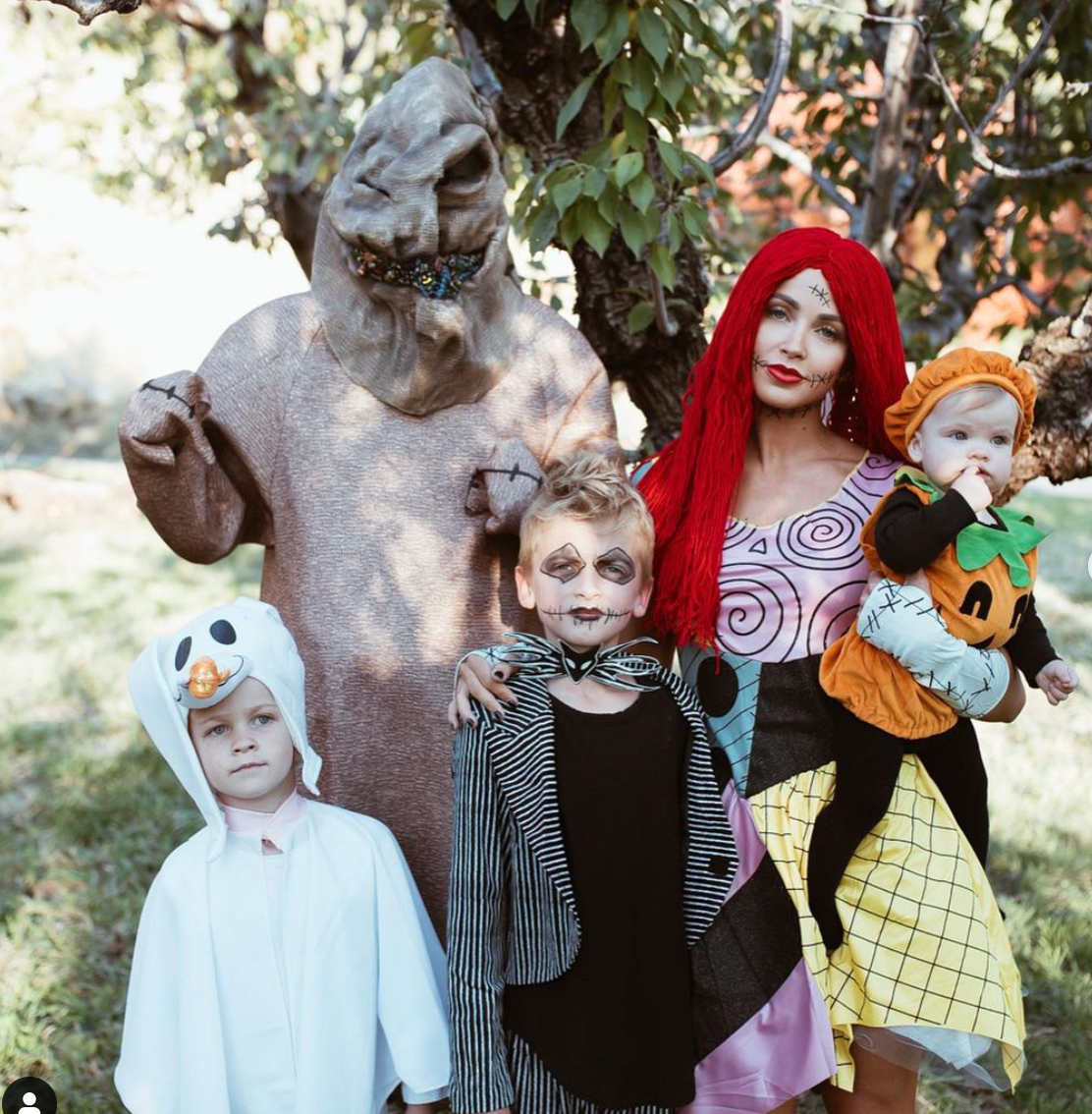 the nightmare before christmas family costume including oogie boogie, sally, jack skellington, zero, and a pumpkin