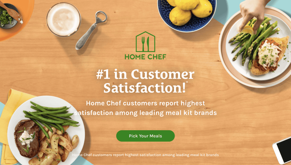 A table with various foods including a steak plate with green beans and potatoes, a latte, a dish of lemons, and another plate with chicken breast, asparagus, and rice. Text reads "#1 in Customer Satisfaction! Perfect for postpartum recovery. Home Chef customers report highest satisfaction among leading meal kit brands." A button below reads "Pick Your Meals.