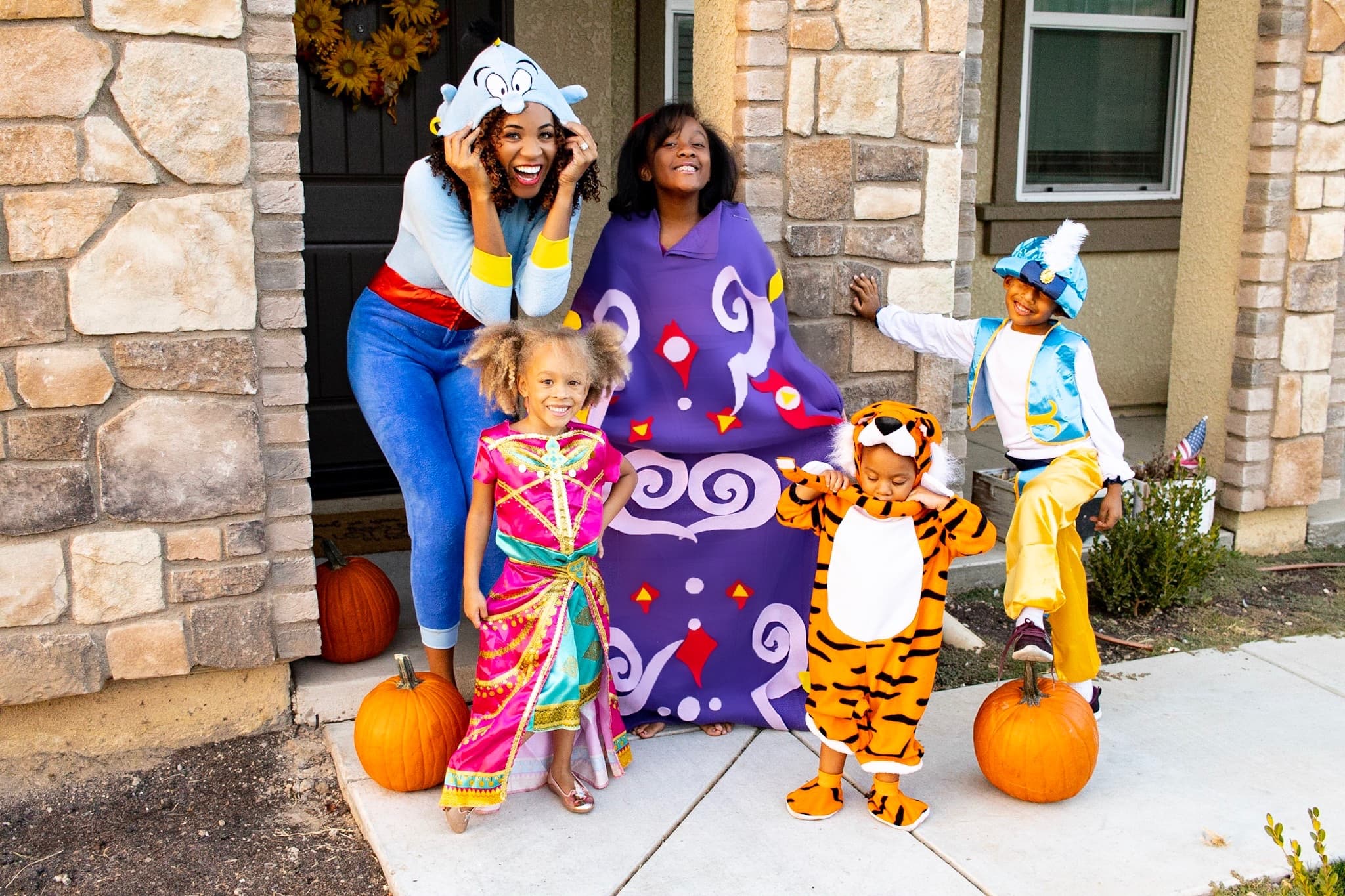 aladdin family costume with aladdin, jasmine, genie, carpet, and raja