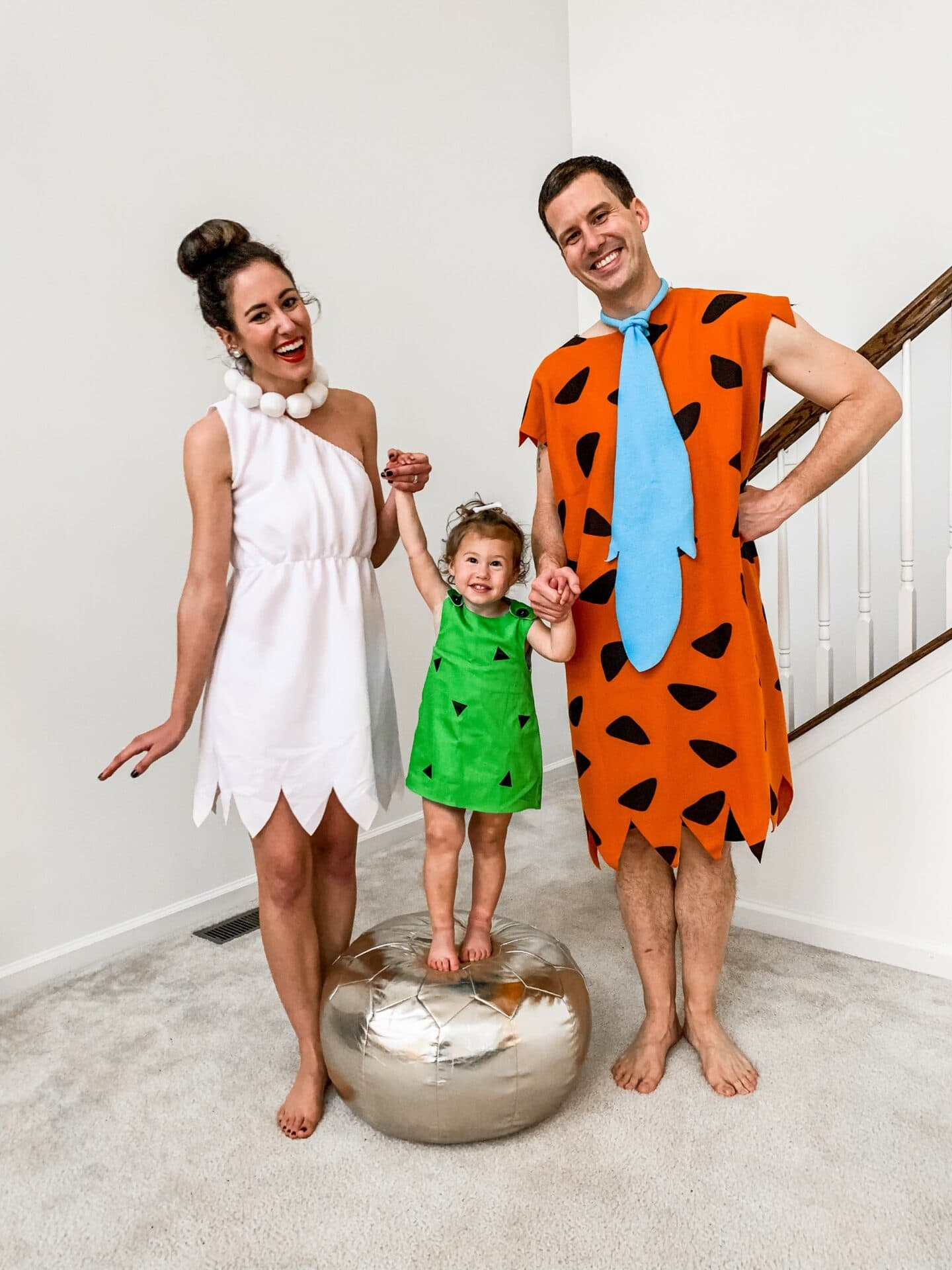 the flintstones family costume with fred, wilma, and pebbles