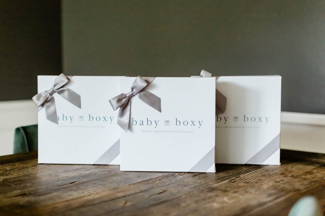 Three Baby Boxy Gift Boxes sitting up on a table.