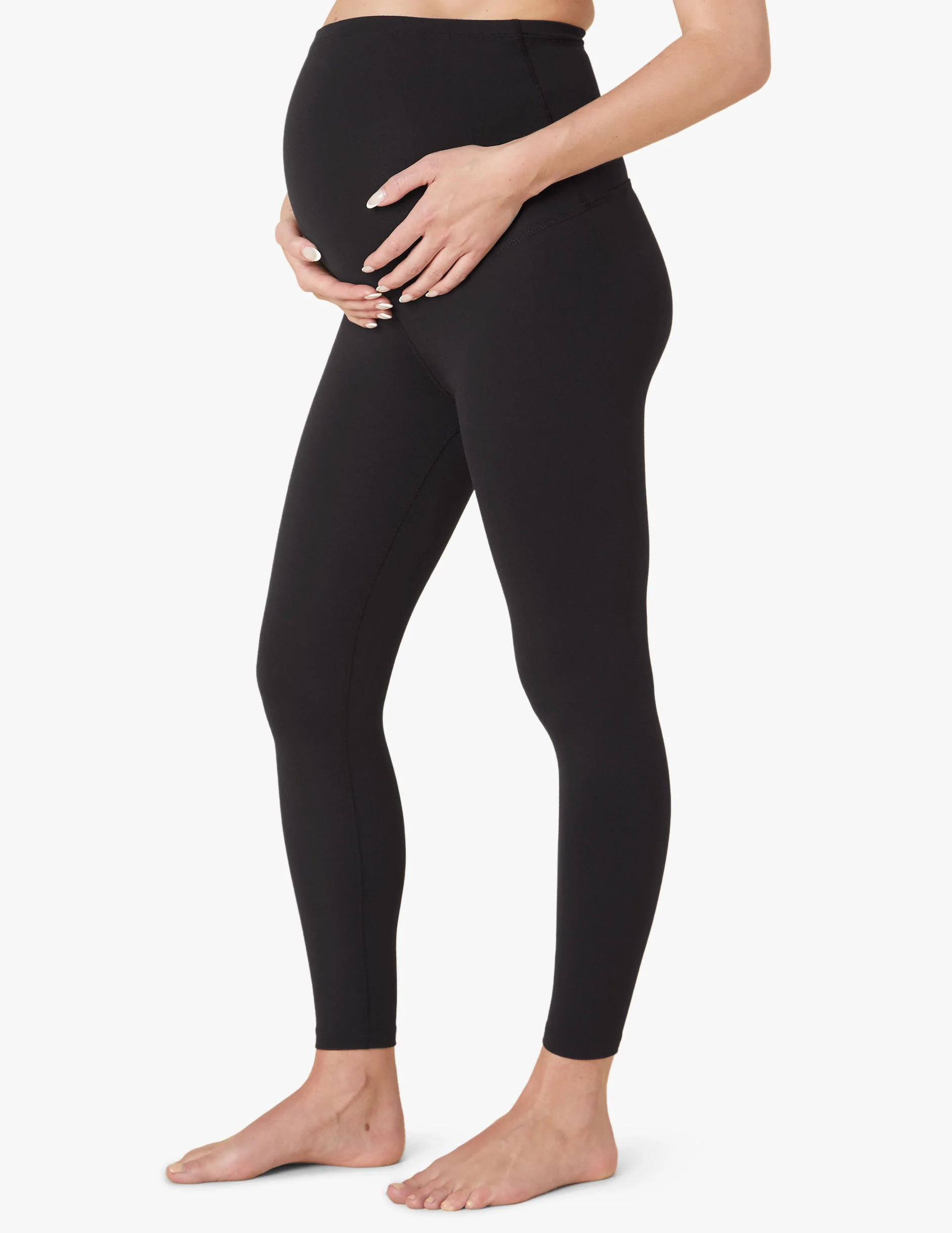 Woman in black maternity leggings 