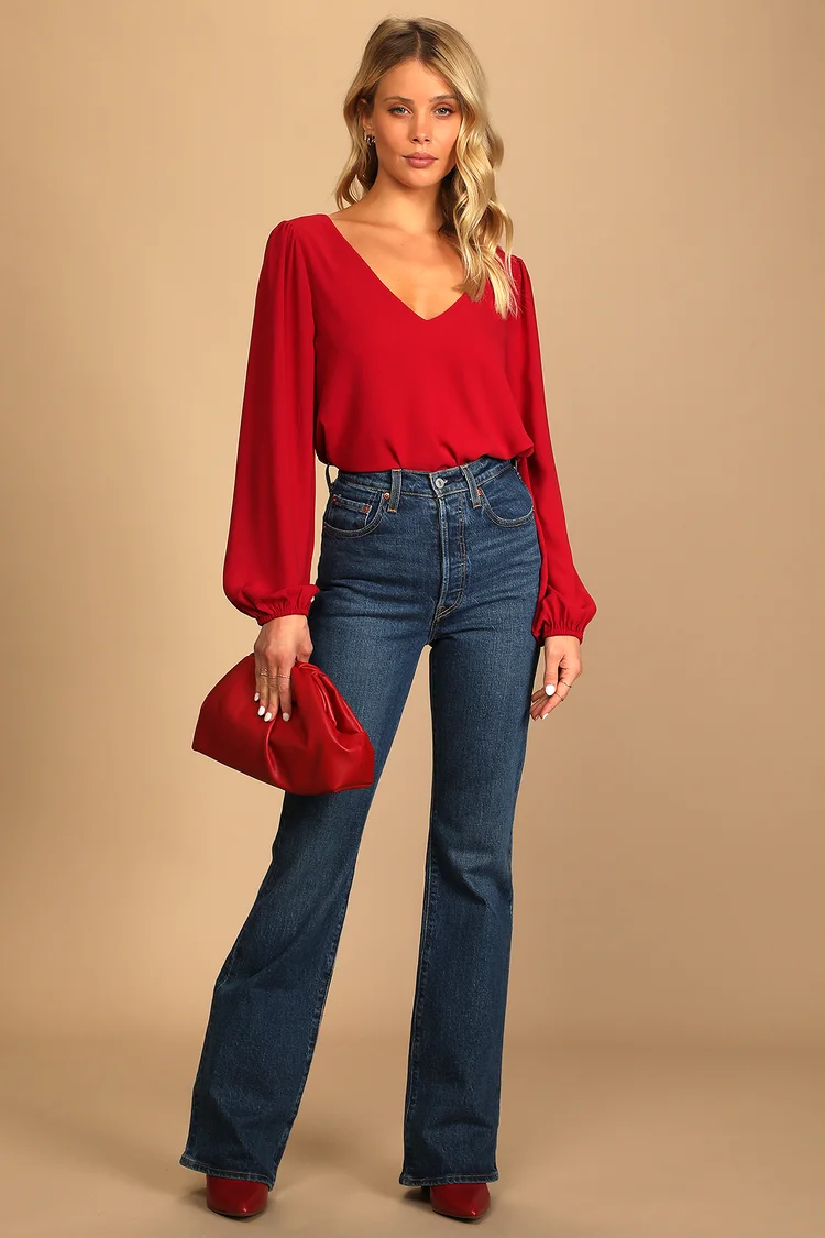 Woman in red blouse and jeans 