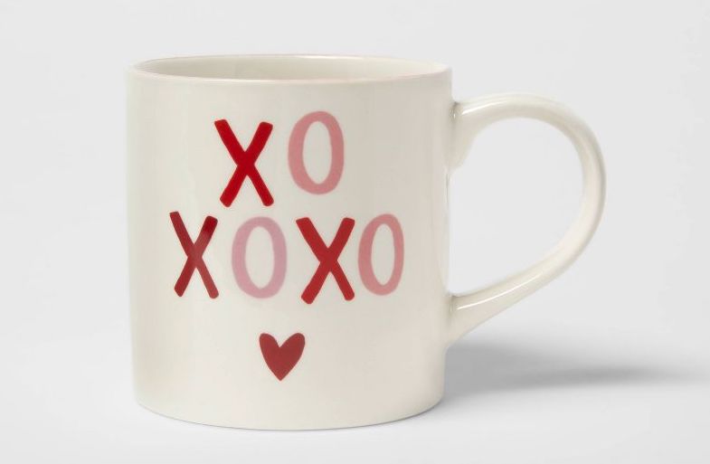 White mug with XOXO and a heart on it in red and pink