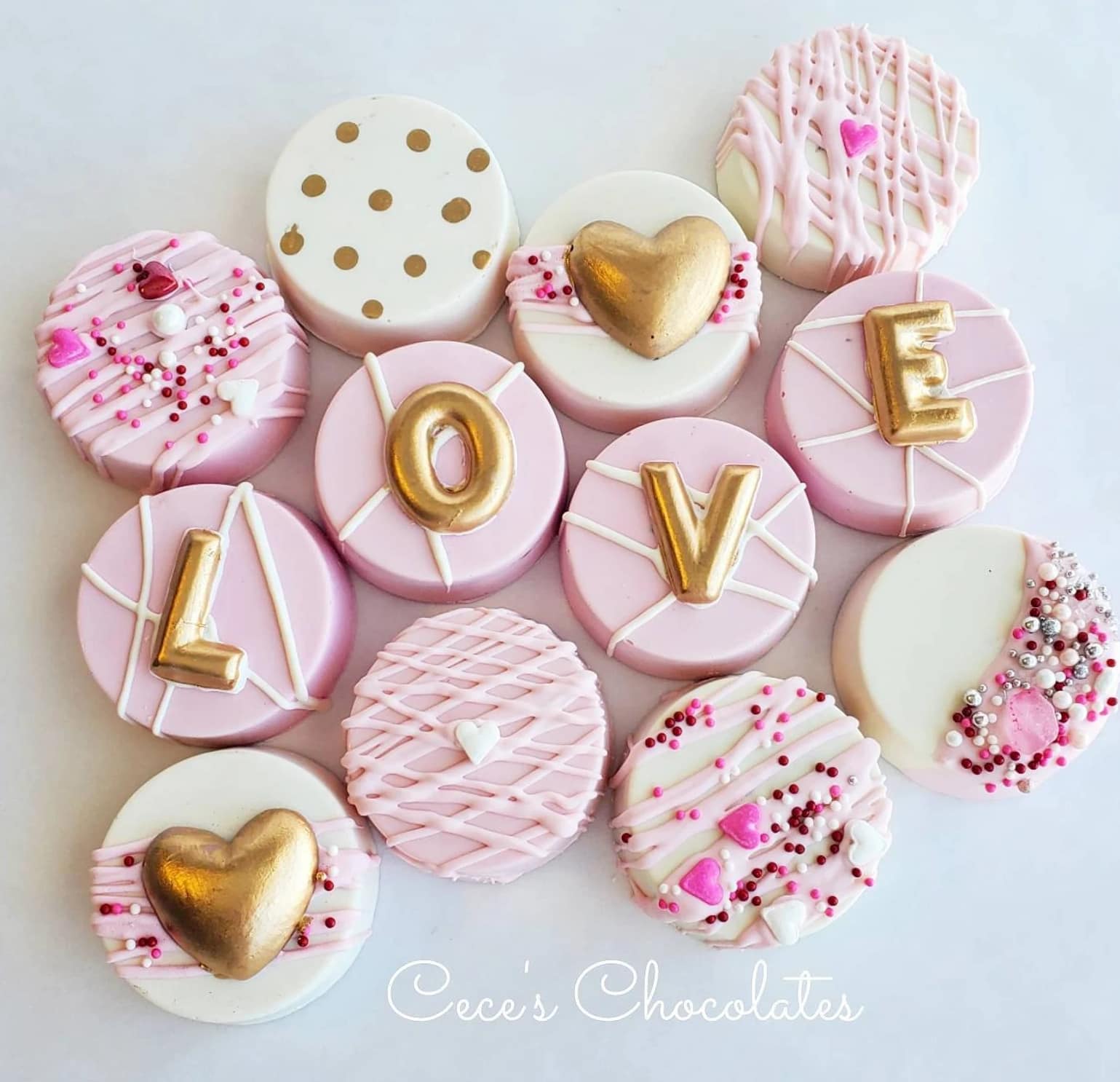 Pink, white and gold decorated chocolate dipped oreos 