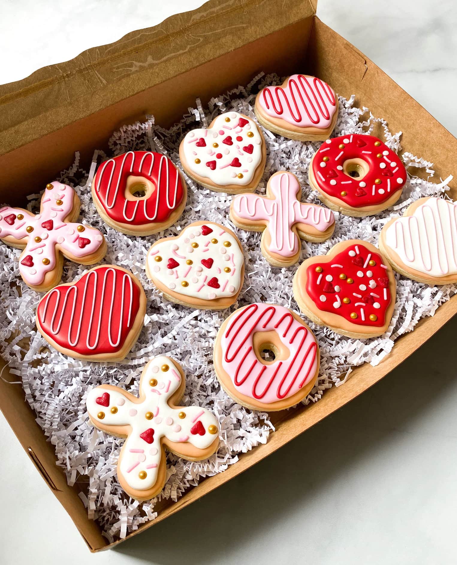 Box of Valentine's Day cookies in red, white, and pink