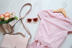 Fashionable concept, pink style. Dress, bag and glasses. View from above.