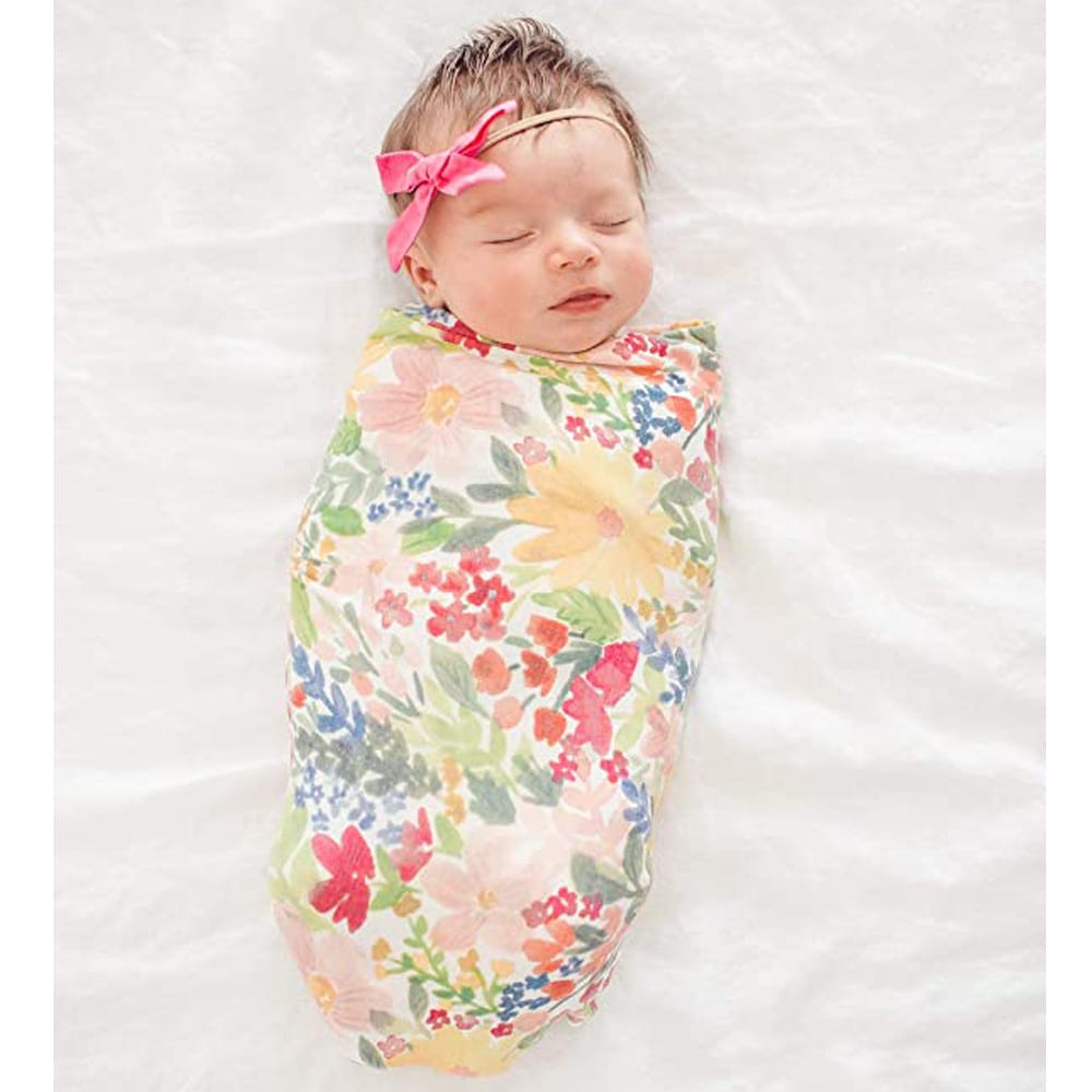 Baby girl swaddled up in a Copper Pearl Swaddle