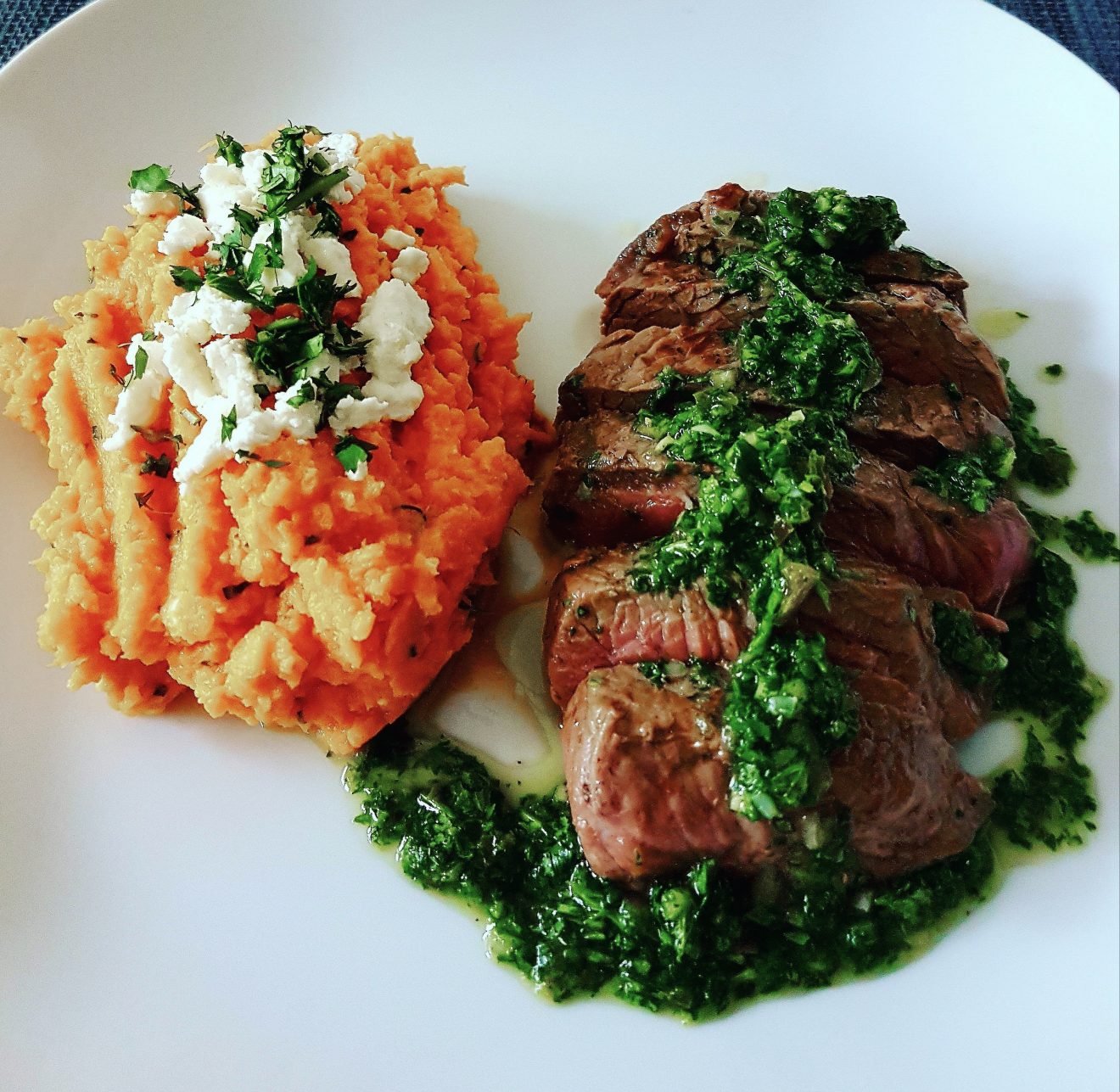 Sirloin Steak and Mashed Sweet Potato, Feta, and Coriander Topped with Homemade Chimichurri