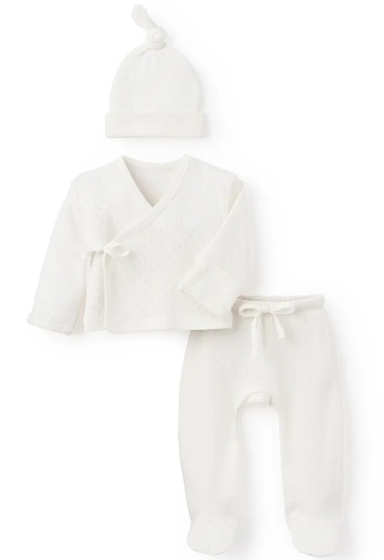 The perfect coming home outfit, this white baby ensemble features a wrap-style cardigan, footed pants, and a knotted beanie, all crafted from the softest fabric.