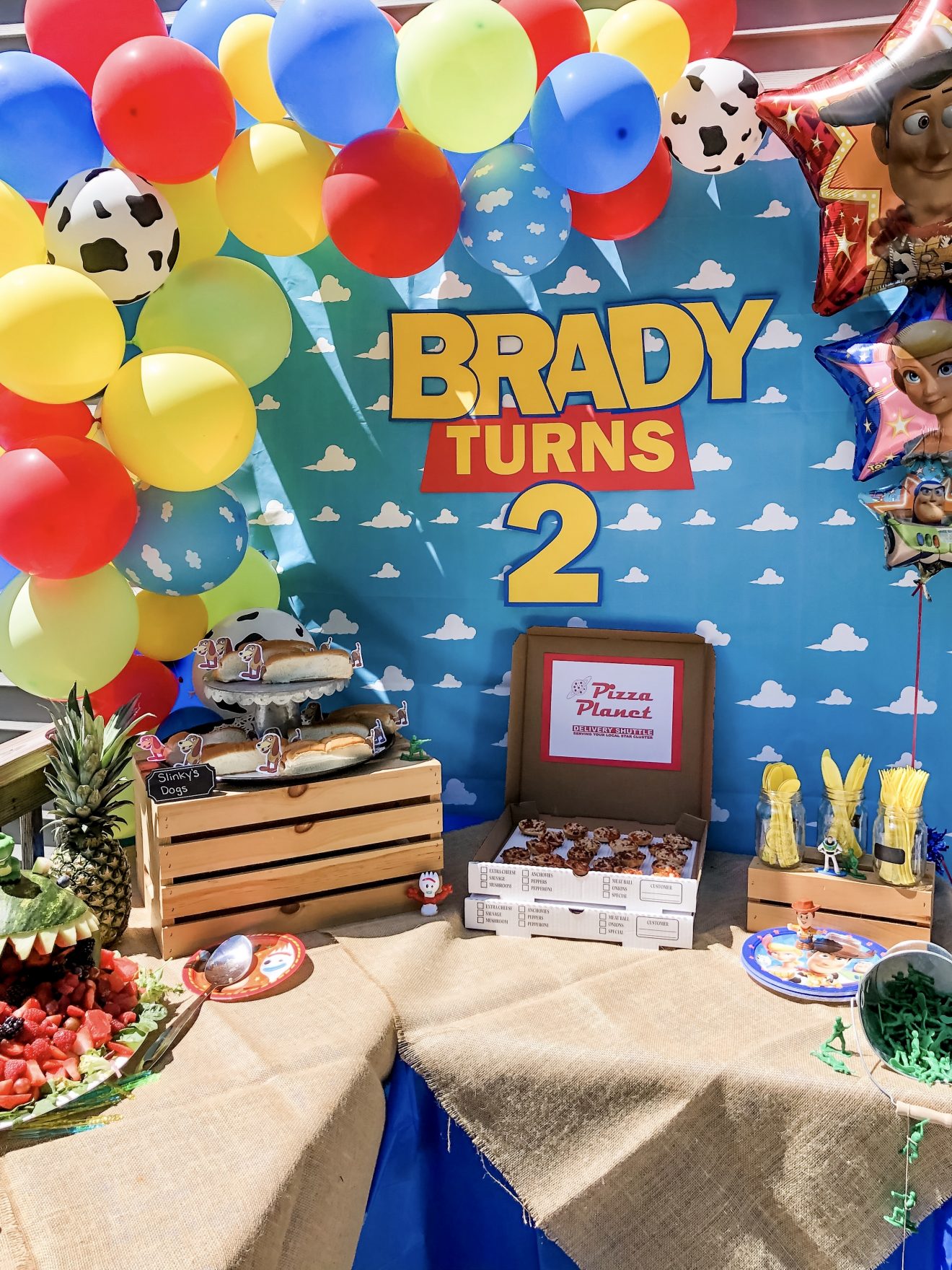 Backyard party for a two-year-old with a Toy Story theme.