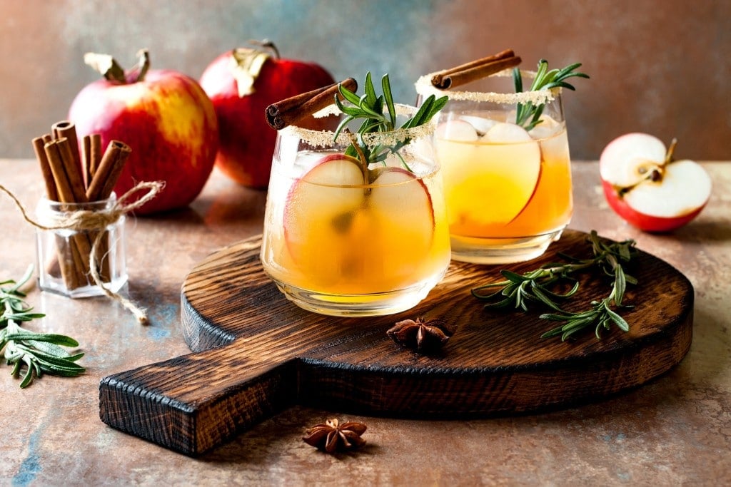 Smoky apple cider fall cocktail with cinnamon, rosemary and star anise.