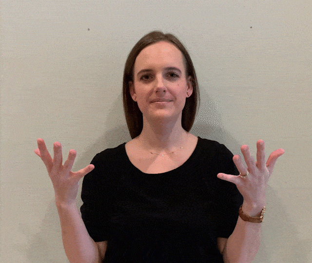 demonstrating "all done" sign language