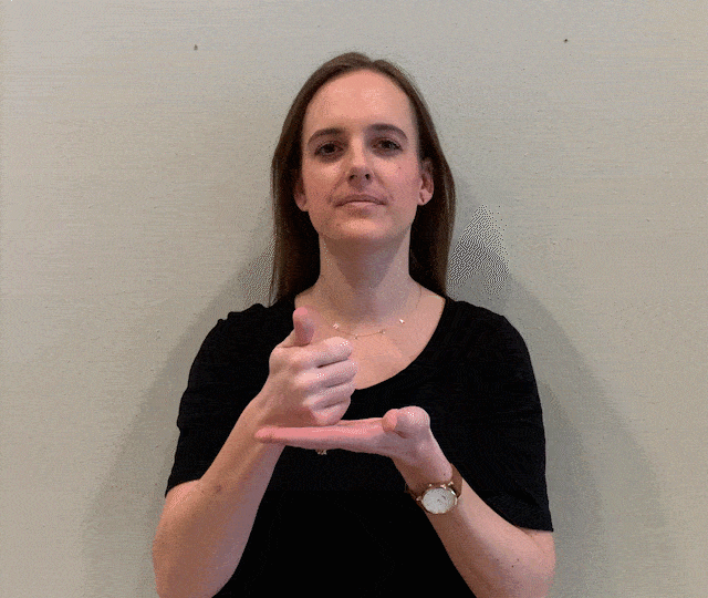 demonstrating "help" sign language