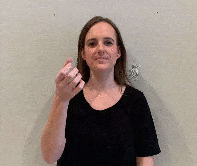 demonstrating "milk" sign language