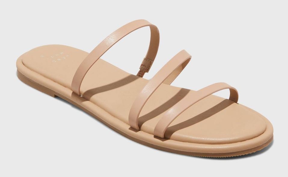 Tan women's flat sandals with three straps over the foot 
