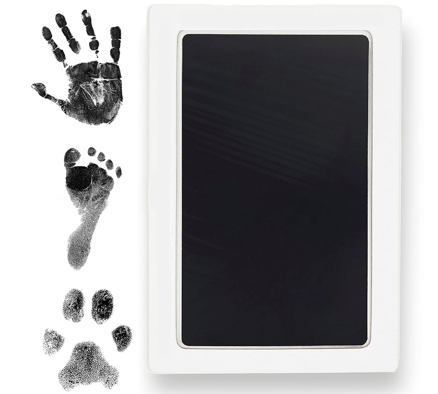 A rectangular ink pad, perfect for creating cherished NICU gifts, sits to the right of three black prints: a human handprint, a human footprint, and a paw print. The pad features a white frame with a black ink surface.