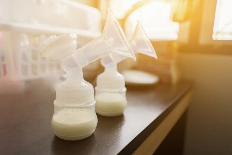Automatic breast pump, mothers breasts milk is the most healthy food for newborn baby in bed room at home.