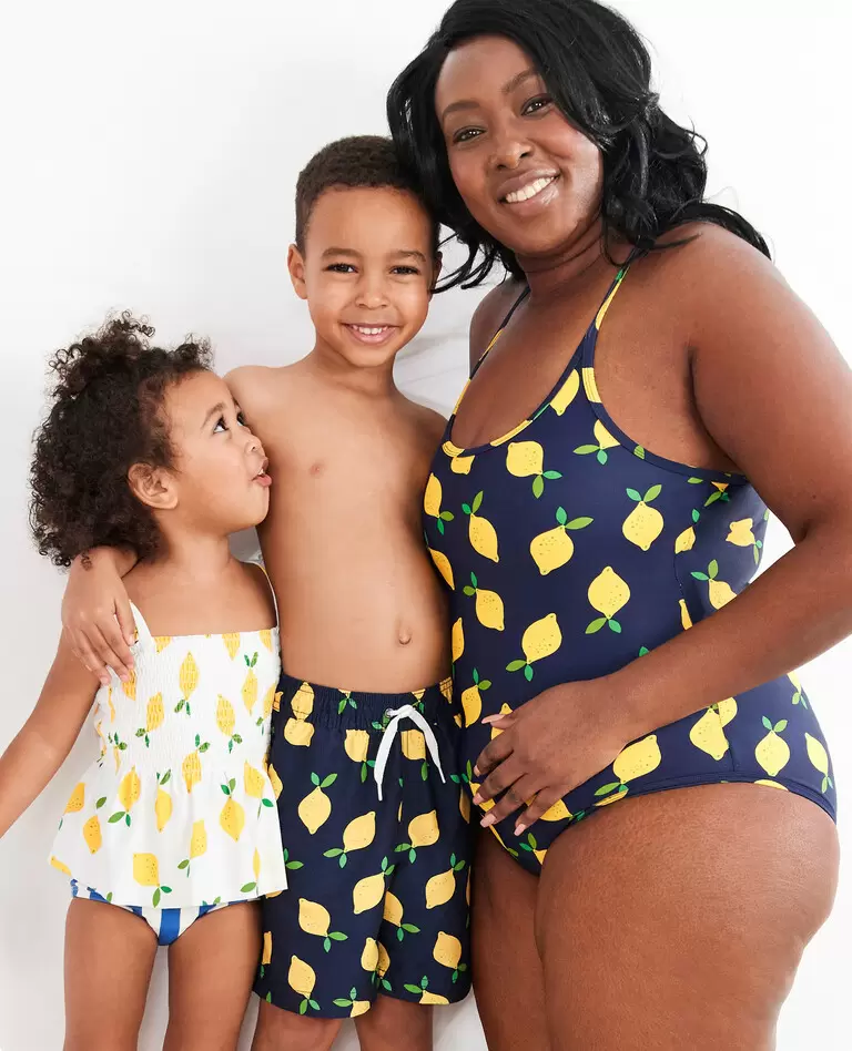 Woman and children in matching lemon swimsuits 