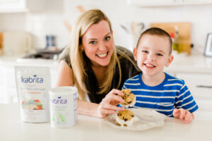 Mom and son making ice cream sandwiches with Kabrita food products.
