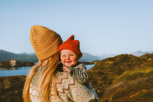 Cute baby and mother walking outdoor travel family vacations lifestyle mom and smiling child together