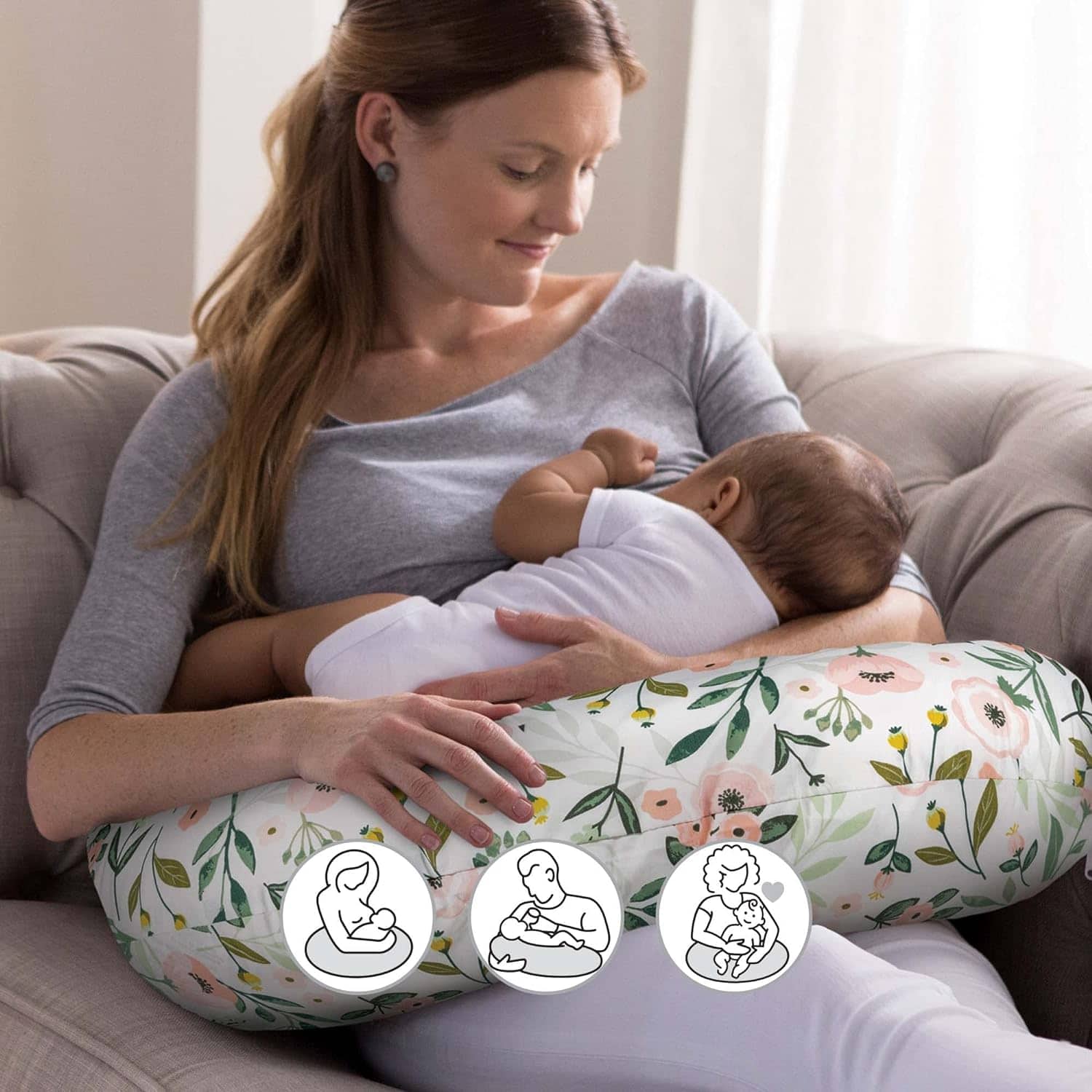 Mom using a breastfeeding pillow while she is nursing her baby