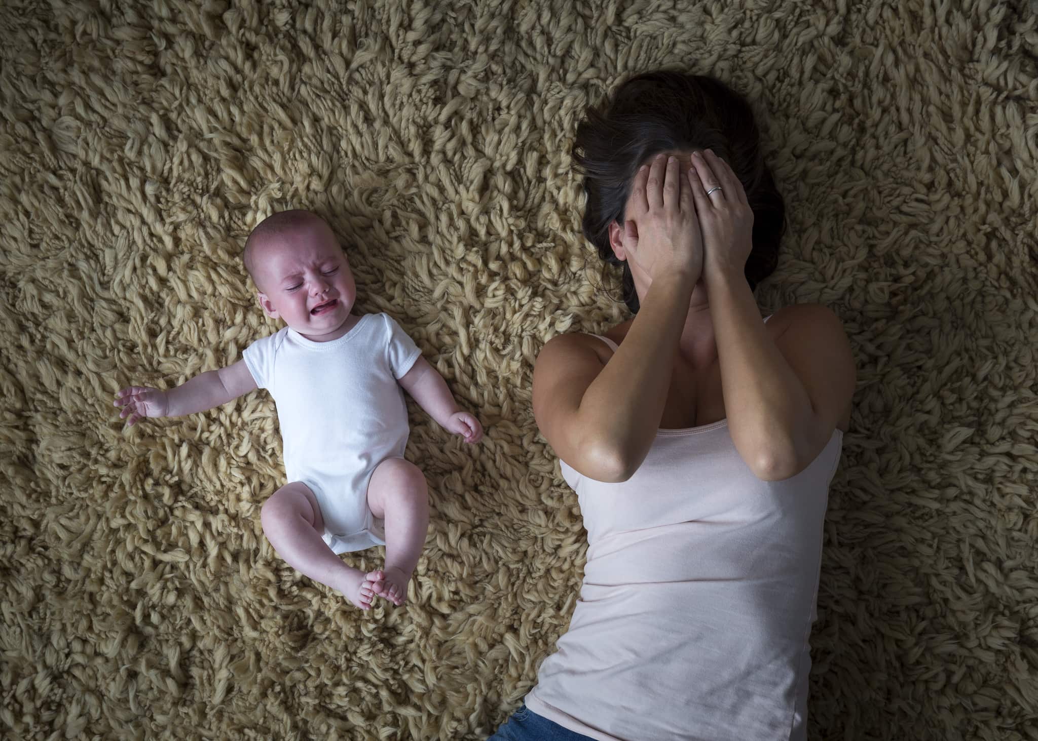 Stressed mother and her baby.