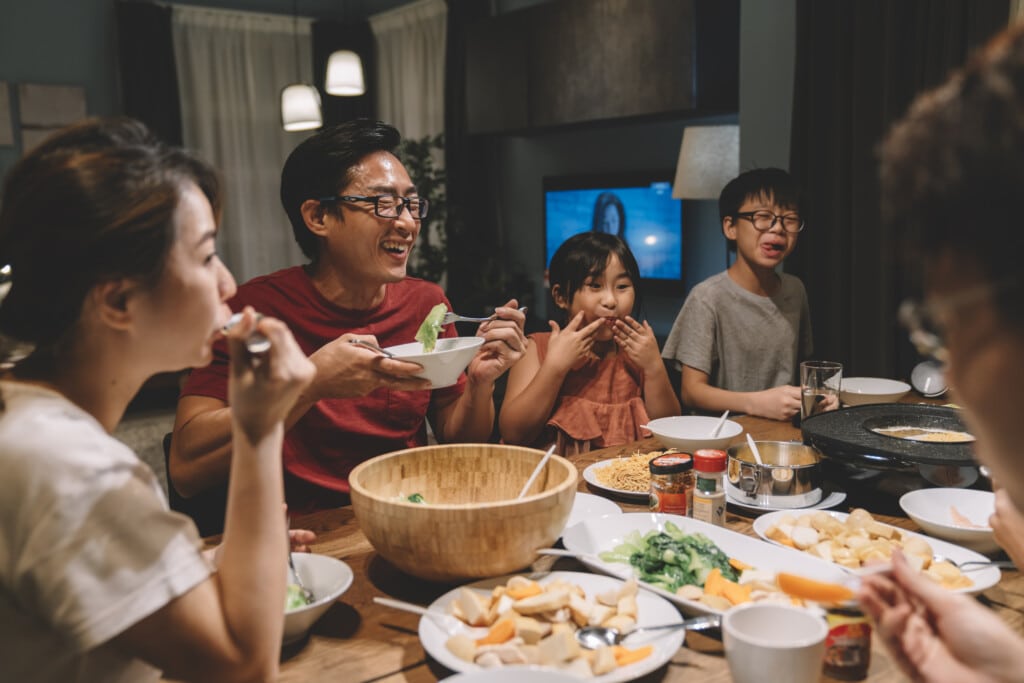 asian chinese family having dinner at home