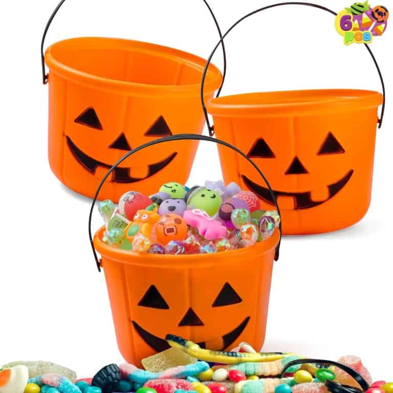 Three orange plastic jack-o-lantern buckets, each with a black handle and a carved smiley face, are displayed. The middle bucket is filled with colorful toys and candies, while the other two are empty. Various candies are scattered at the bottom of the image—perfect Halloween gifts for kids!