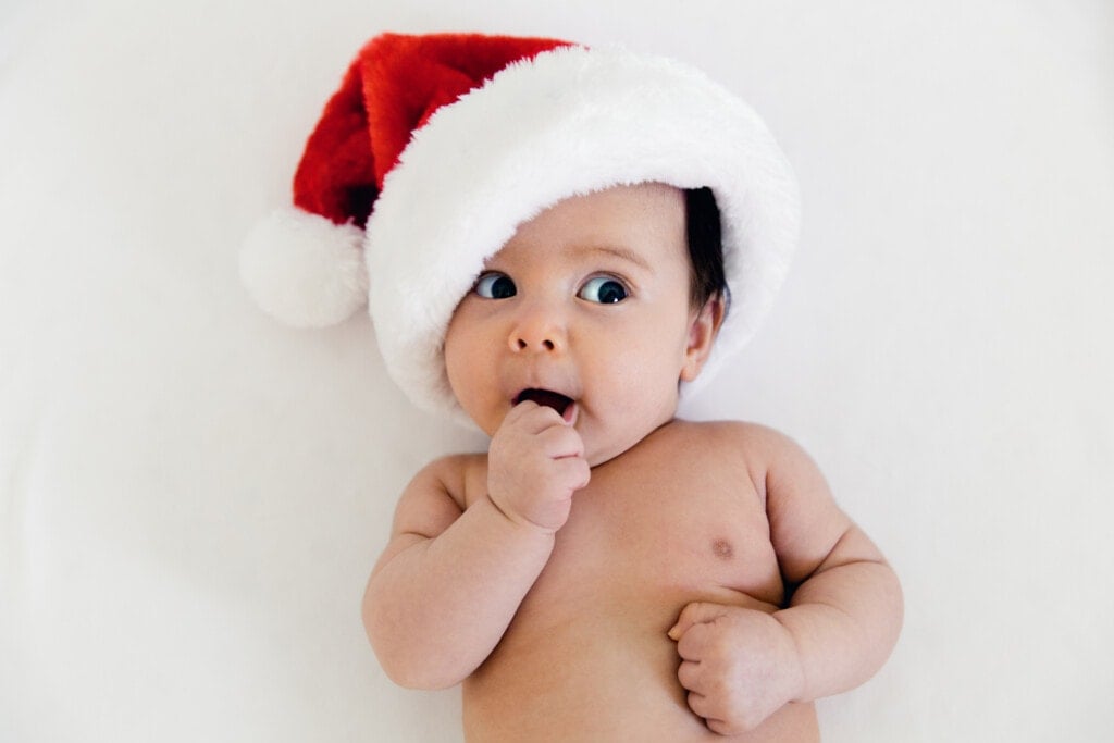Adorable baby in a Santa Claus hat