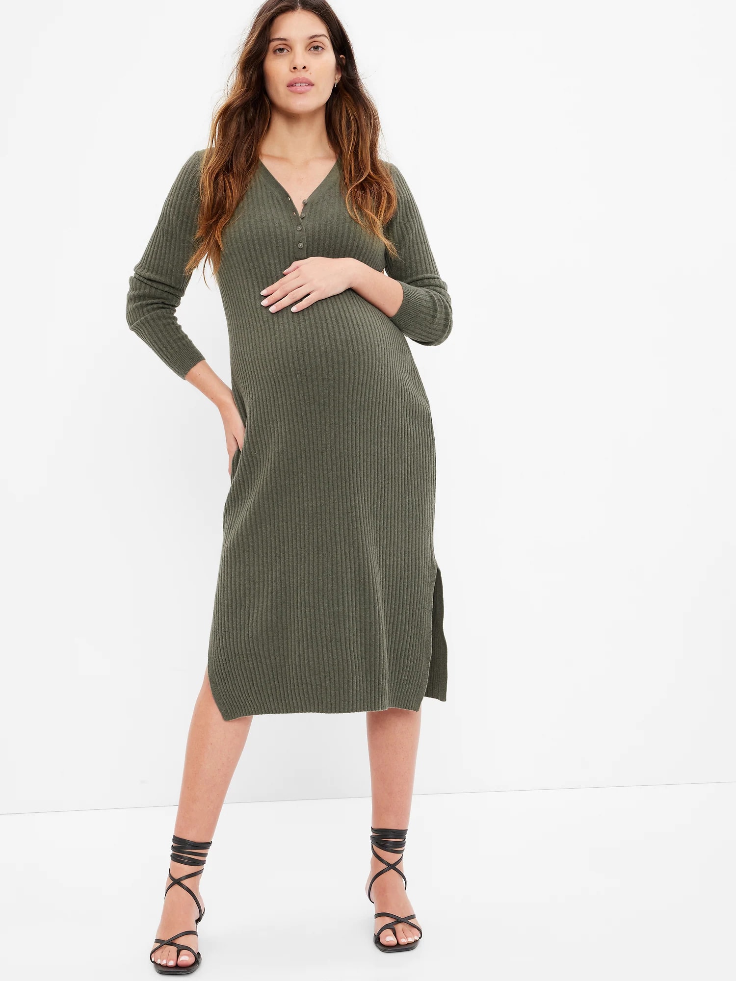 Woman in green henley maternity dress