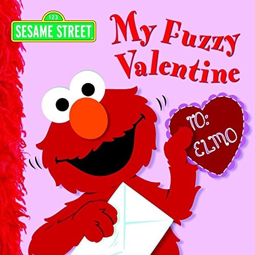 Elmo holding a heart card 