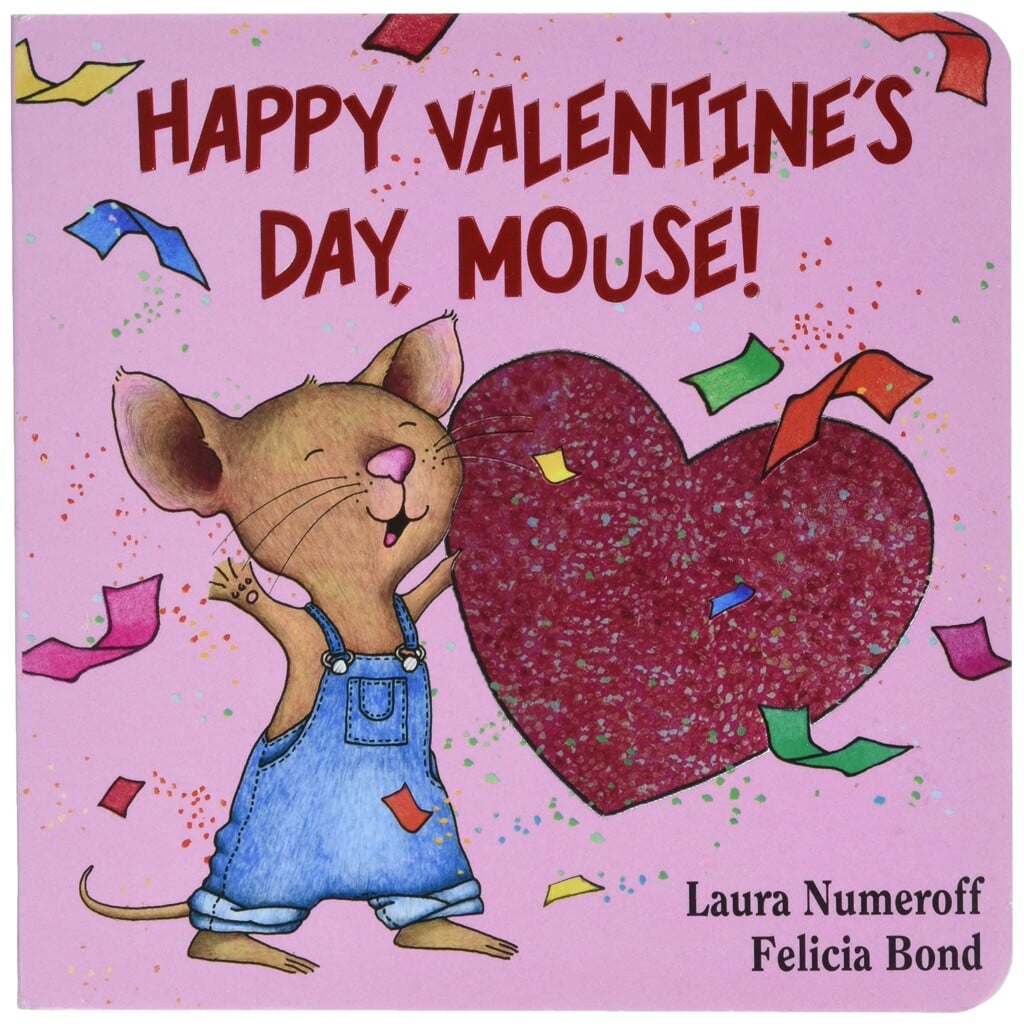 A mouse standing next to a heart with confetti 