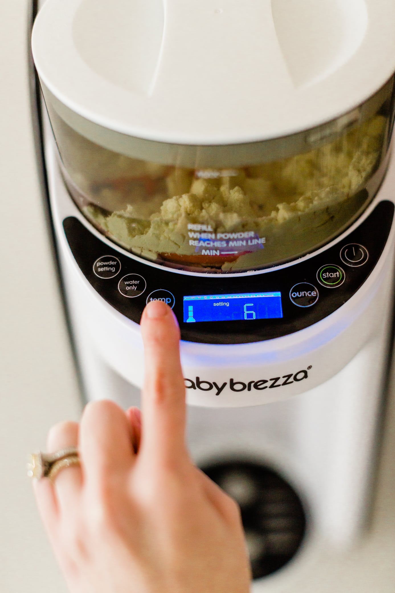 Choosing the temperature on the Baby Brezza.
