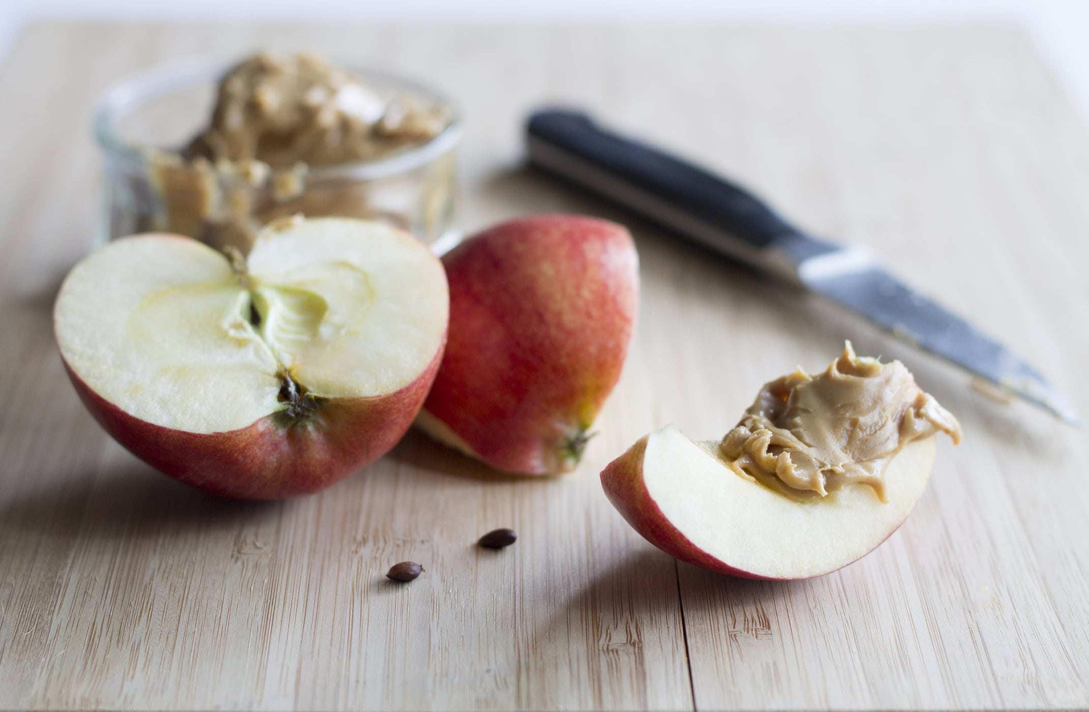 a crisp slice of apple and a scoop of creamy peanut butter, ready to be devoured!