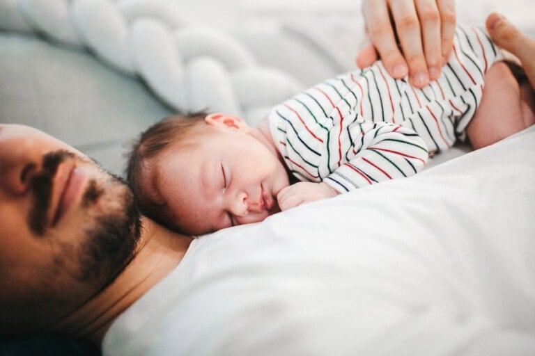 Father and baby son sleeping